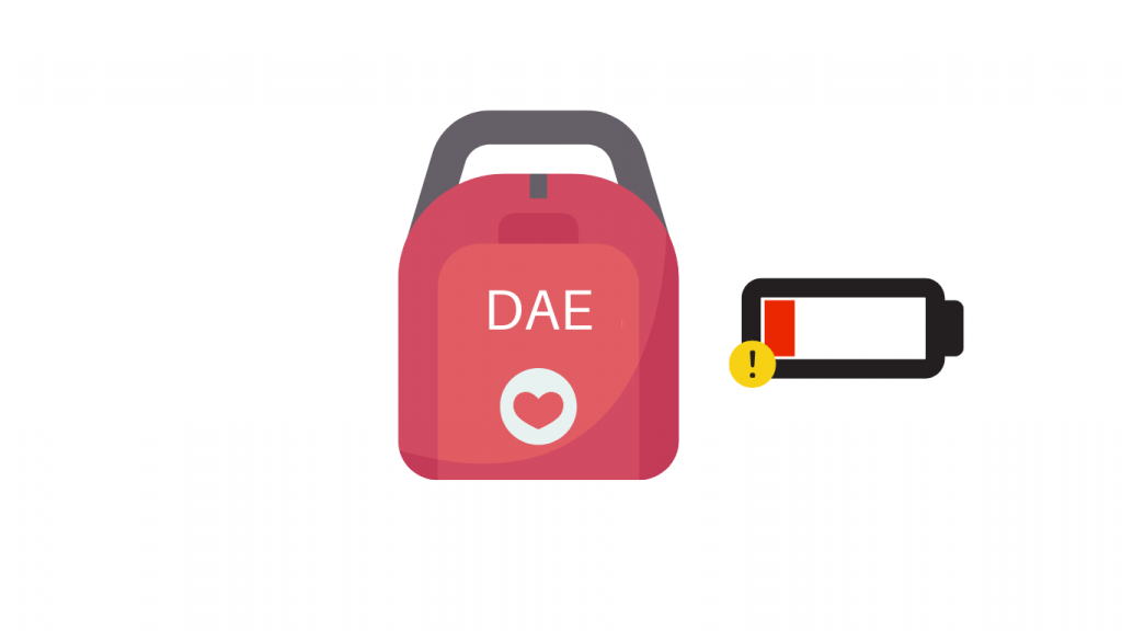 Défibrillateur avec batterie faible et icône d'avertissement.